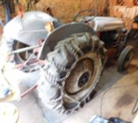 A tractor with a large tire

AI-generated content may be incorrect.