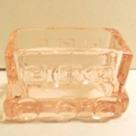 A glass container with wheels

AI-generated content may be incorrect.